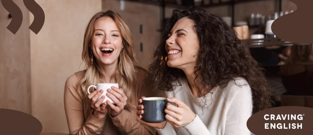 Two friends laughing while having coffee