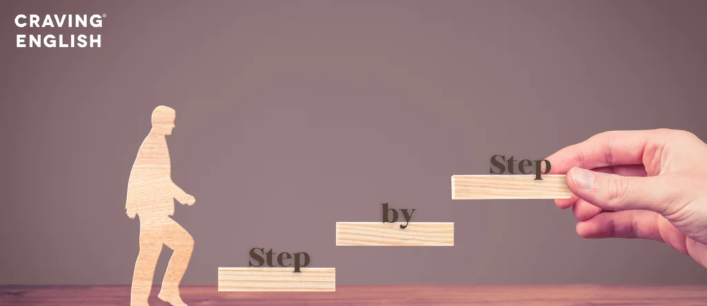 Wooden figure climbing blocks that spell 'Step by step'
