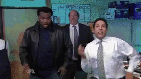 GIF of three office coworkers dancing and celebrating